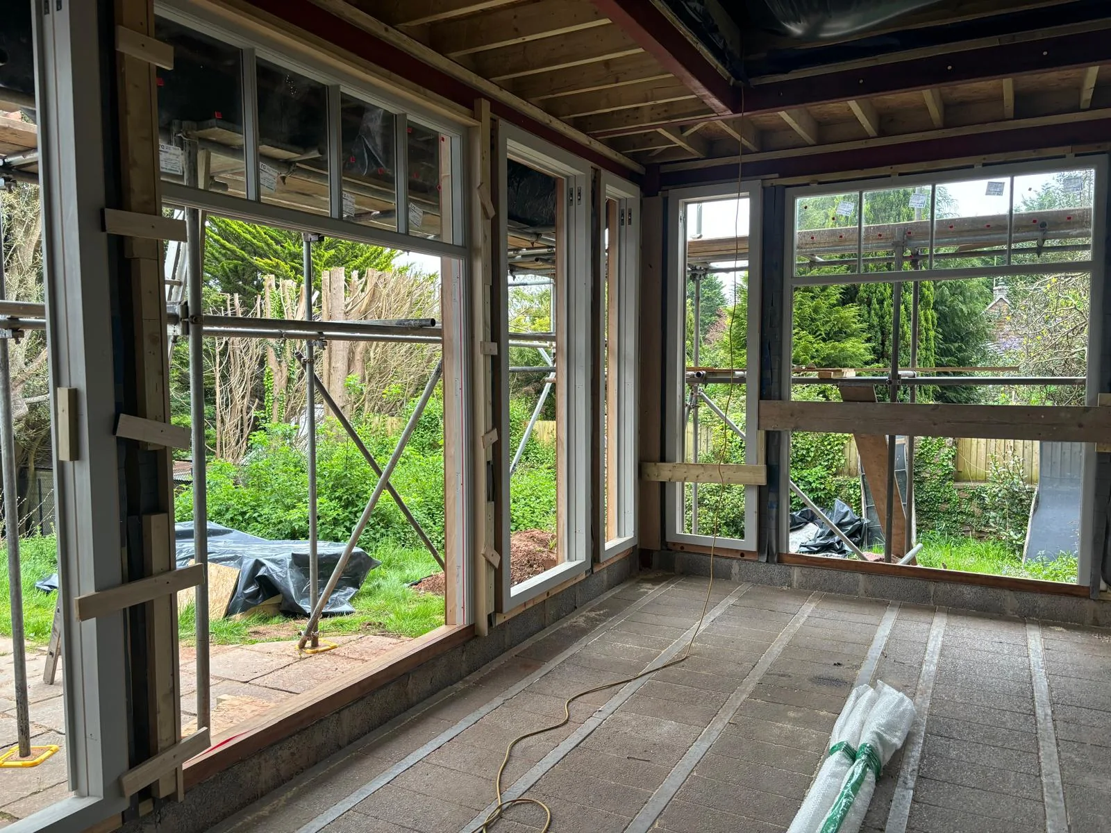 New Accoya sash windows installed in timber-clad facade.