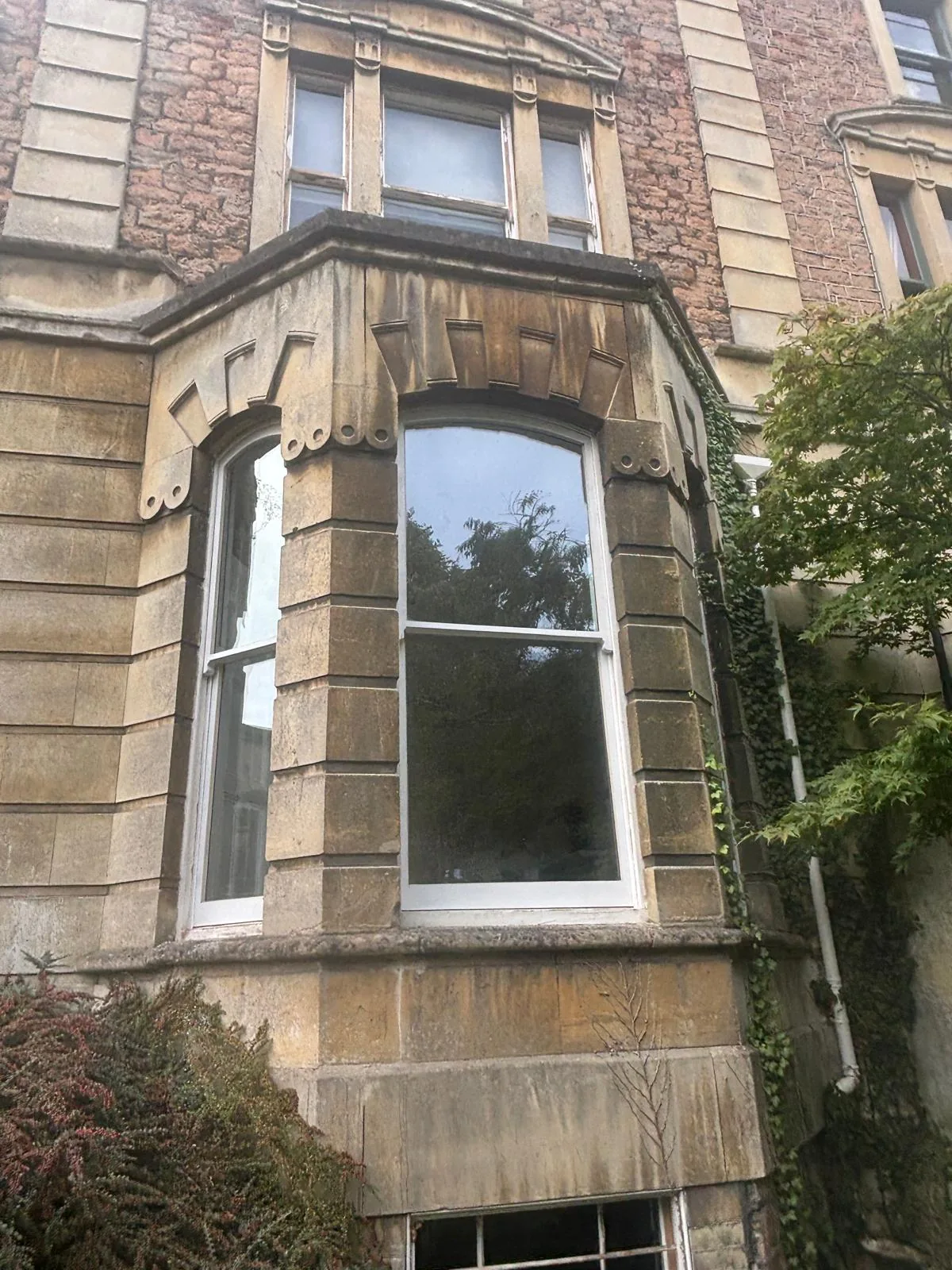 Close-up of a projecting bay sash window.