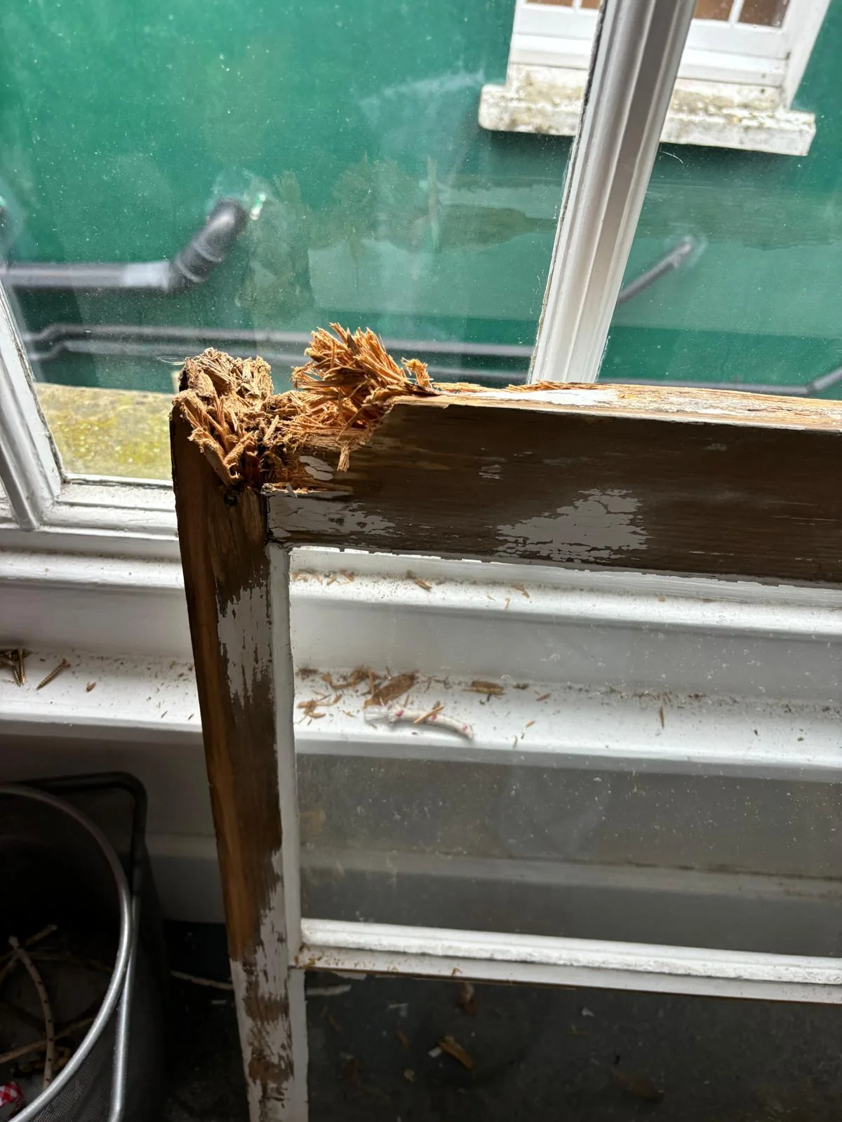Close-up of severe rot at sash window rail joint.