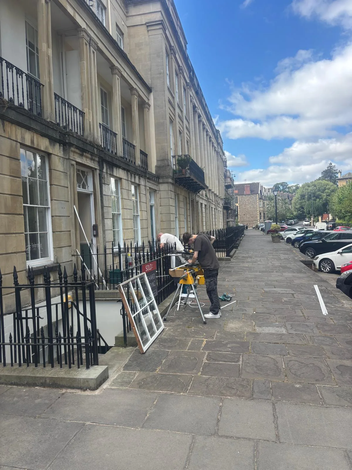 Street view of period building and sash window work.