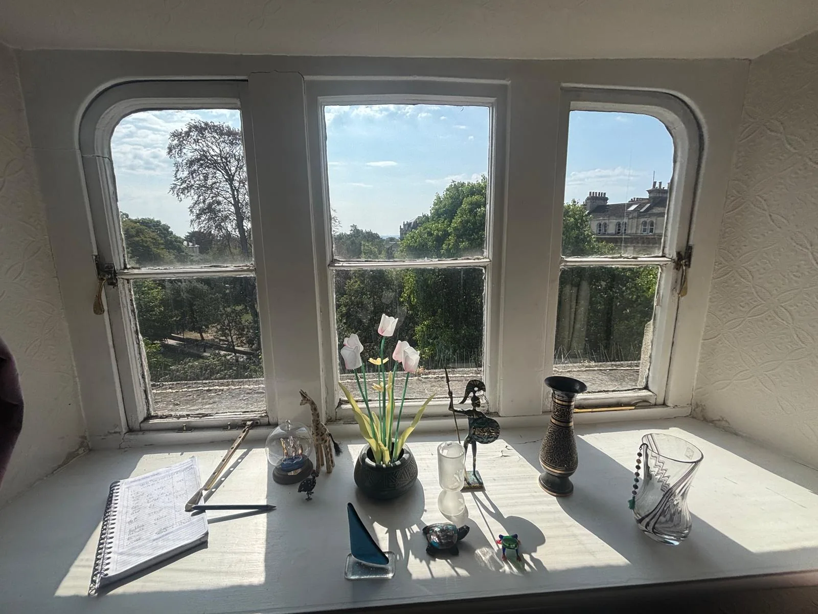 Interior view of three-part curved bay sash window.