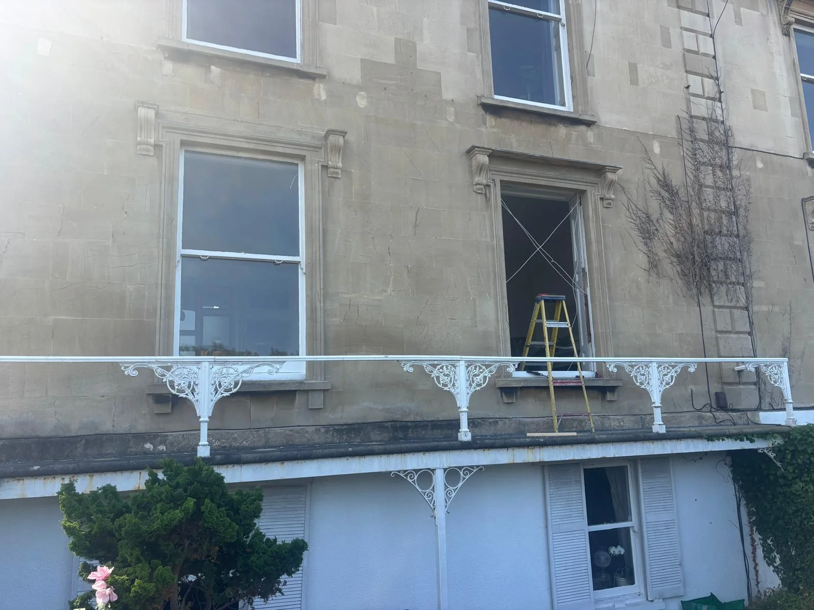 Scaffolded period building elevation with sash windows.